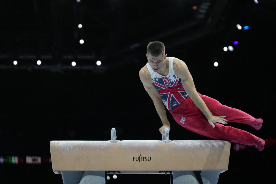 FILE - Great Britain's Max Whitlock performs on the pommel horse during Men's Qualifications at the Artistic Gymnastics World Championships in Antwerp, Belgium, Saturday, Sept. 30, 2023. Triple Olympic gold medalist Max Whitlock says he will end his 24-year gymnastics career after the Paris Olympics. (AP Photo/Virginia Mayo, File)