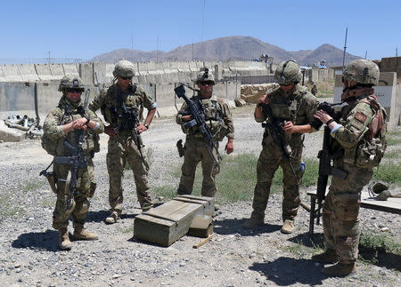 U.S. military advisers from the 1st Security Force Assistance Brigade stand at an Afghan National Army base in Maidan Wardak province, Afghanistan August 6, 2018. REUTERS/James Mackenzie