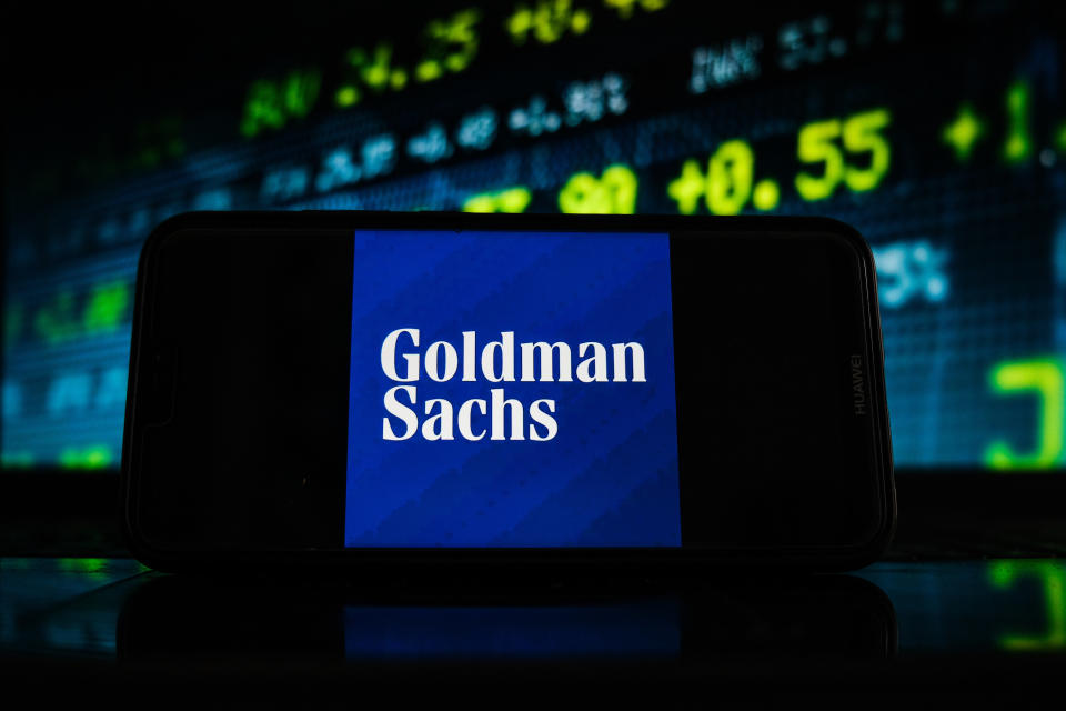 POLAND - 2021/02/07: In this photo illustration a Goldman Sachs logo seen displayed on a smartphone screen with stock market graphic on the background. (Photo Illustration by Omar Marques/SOPA Images/LightRocket via Getty Images)