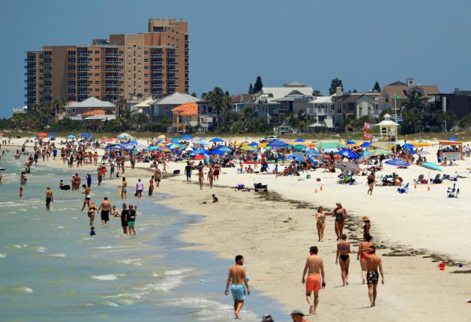 People visit Clearwater Beach after Governor Ron DeSantis opened the beaches on 4 May in Clearwater, Florida.