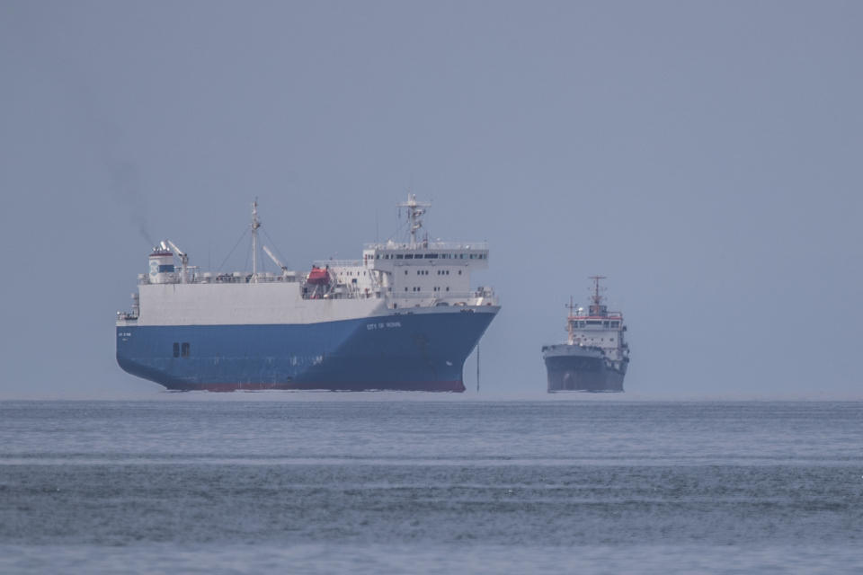 Anchored ships are seen miles away from the port of Piraeus, near Athens, Greece, Tuesday, May 26, 202. About 150,000 seafarers are stranded at sea in need of crew changes, according to the International Chamber of Shipping. Roughly another 150,000 are stuck on shore, waiting to get back to work. (AP Photo/Petros Giannakouris)