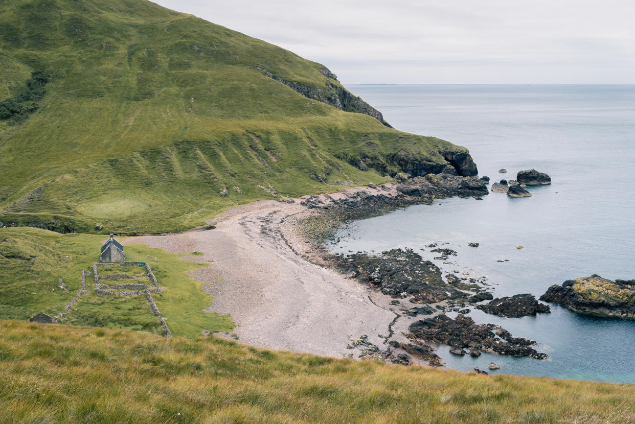 SCOTLAND, August 2019: The Guirdil bothy at the western coastline of the Isle of Rum, a small island at the West Coast of Scotland (Scottish Highlands).