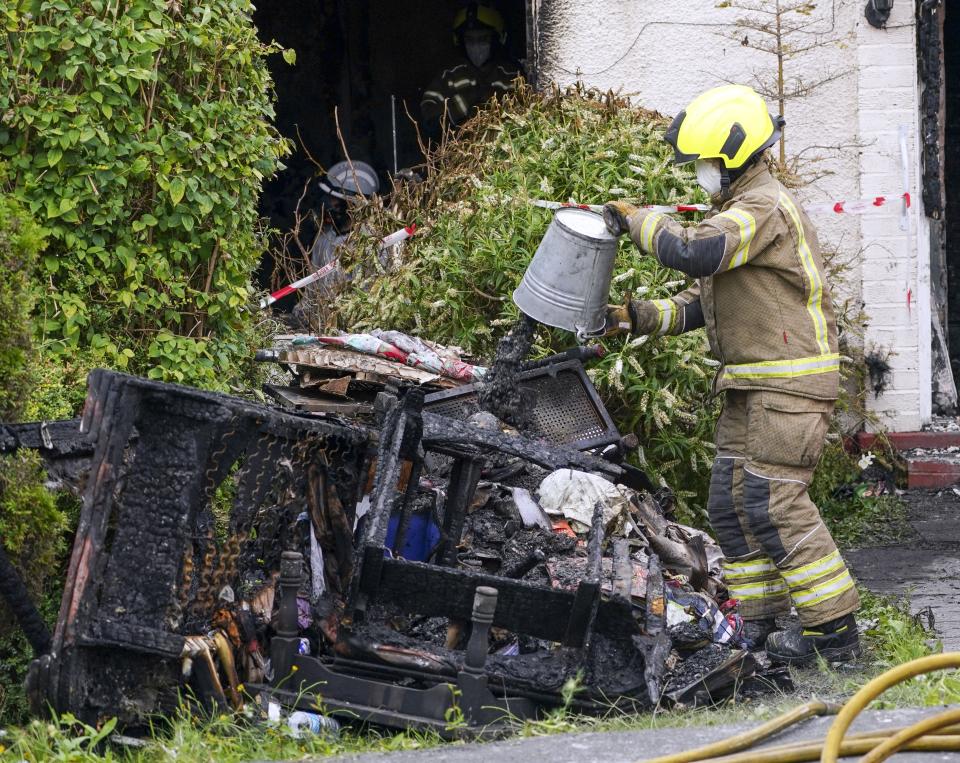 Firefighters worked to clear debris from the incident on Saturday (Steve Parsons/PA) (PA Wire)