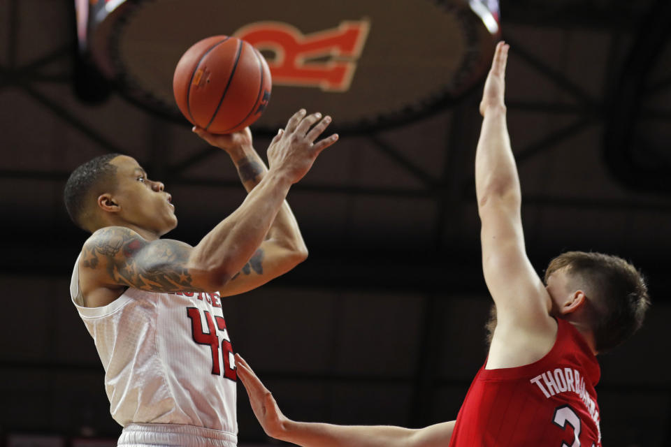 Rutgers guard Jacob Young (42) shoots over Nebraska guard Thorir Thorbjarnarson (34) during the second half of an NCAA college basketball game Saturday, Jan. 25, 2020, in Piscataway, N.J. (AP Photo/Adam Hunger)