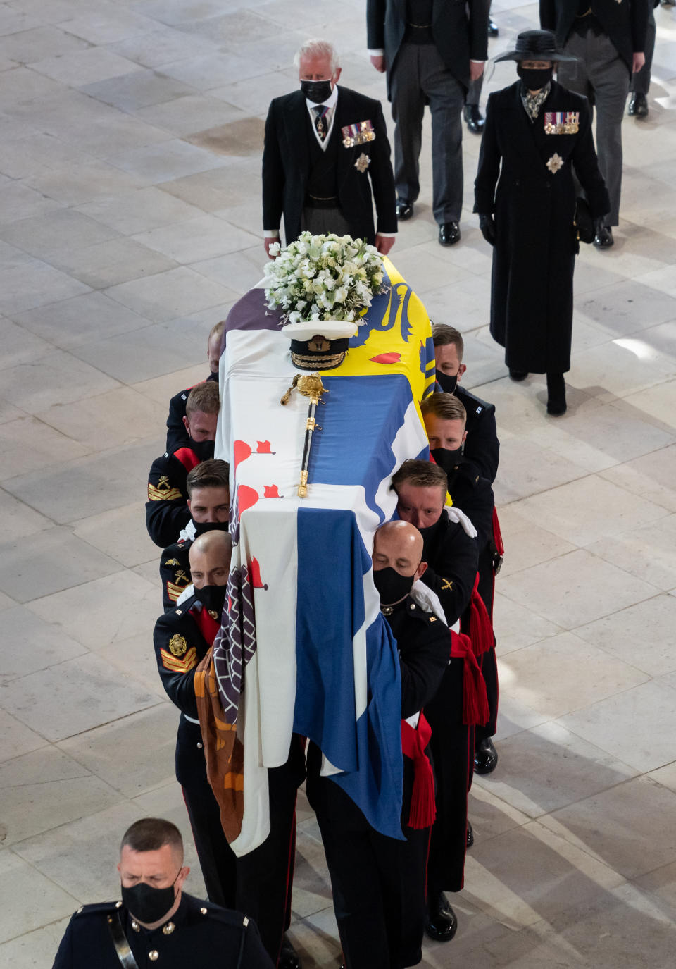 Pall Bearers carrying the coffin of the Duke of Edinburgh, followed by the Prince of Wales (left), Princess Anne (right) in St George's Chapel, Windsor Castle, Berkshire. Picture date: Saturday April 17, 2021.