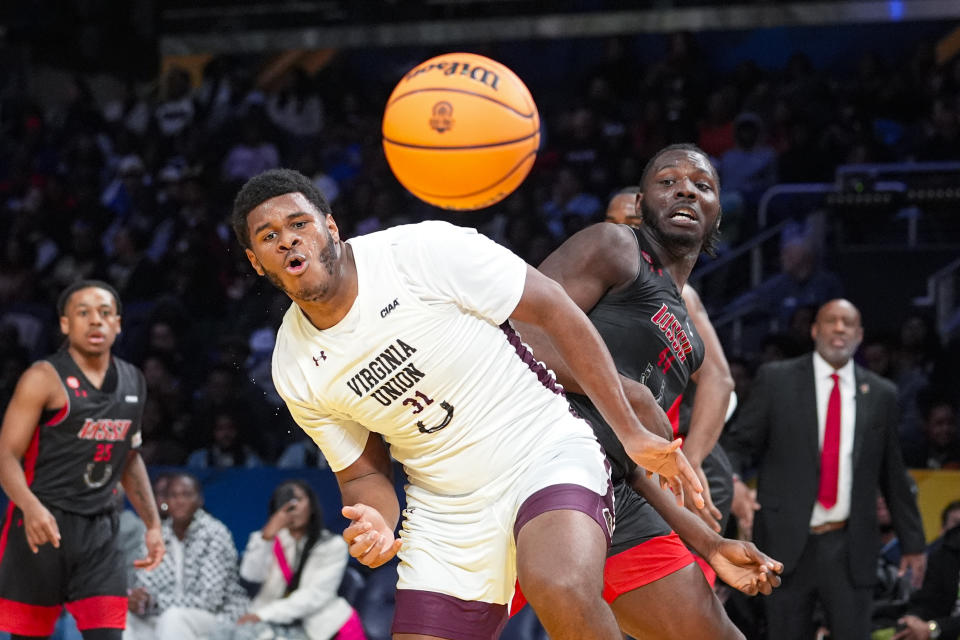 Virginia Union forward Malachi Dark (31) and Winston-Salem State forward Imajae Dodd (44) go for a loose ball during the first half of the HBCU Classic NCAA college basketball game in Indianapolis, Saturday, Feb. 17, 2024. (AP Photo/Michael Conroy)