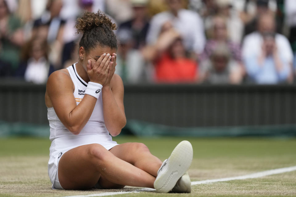 Jasmine Paolini of Italy reacts after she slipped over on court after attempting to play a return to Barbora Krejcikova of the Czech Republic during the women's singles final at the Wimbledon tennis championships in London, Saturday, July 13, 2024. (AP Photo/Mosa'ab Elshamy)