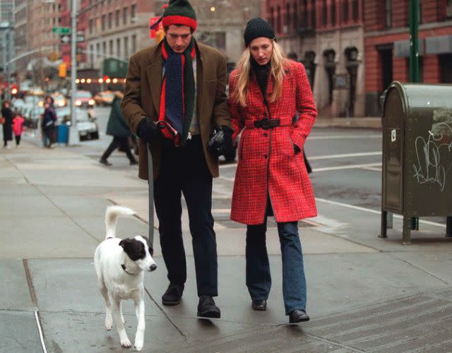 292061 08: (MAGAZINES PLEASE CALL) John F. Kennedy Jr. and his wife Carolyn walk with their dog January 1, 1997 in New York City. July 16, 2000 marks the one-year anniversary of the plane crash off the coast of Martha’s Vineyard in Massachusetts that killed John F. Kennedy Jr., 38, his wife Carolyn Bessette Kennedy, 33, and her sister Lauren Bessette, 34. (Photo by Evan Agostini/Liaison)