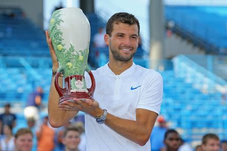 Aug 20, 2017; Mason, OH, USA; Grigor Dimitrov (BUL) holds the Rookwood Cup after defeating Nick Kyrgios (AUS) in the finals during the Western and Southern Open at the Lindner Family Tennis Center. Mandatory Credit: Aaron Doster-USA TODAY Sports