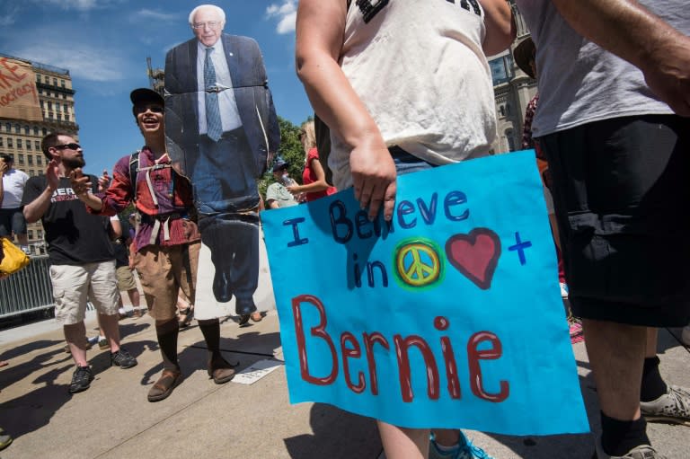 A supporter of Bernie Sanders holds a cardboard cutout of the former US Democratic presidential candidate in Philadelphia on July 24, 2016