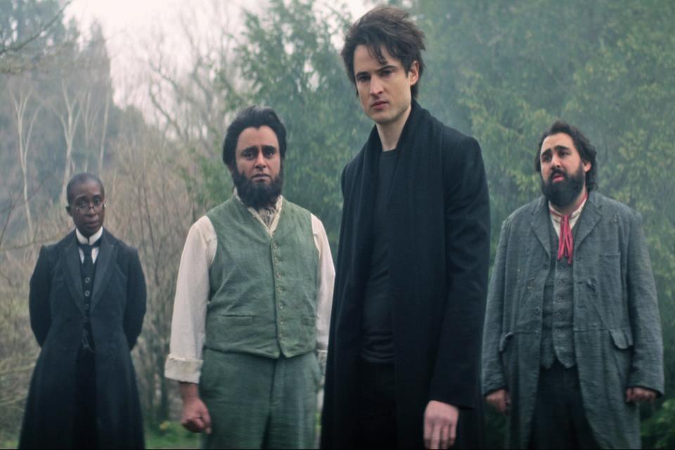 The Sandman. (L to R) Vivienne Acheampong as Lucienne, Sanjeev Bhaskar as Cain, Tom Sturridge as Dream, Asim Chaudhry as Abel in episode 102 of The Sandman. Cr. Courtesy of Netflix © 2022