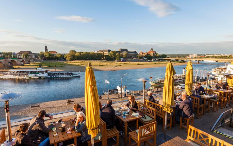 Diners tuck in at the Restaurant Radeberger Spezialausschank on the Elbe