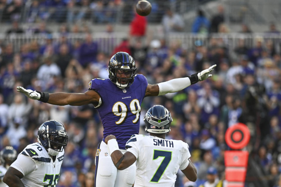 Nov 5, 2023; Baltimore, Maryland, USA;  Baltimore Ravens linebacker Odafe Oweh (99) leaps as Seattle Seahawks quarterback Geno Smith (7) throws during the second half at M&T Bank Stadium. Mandatory Credit: Tommy Gilligan-USA TODAY Sports