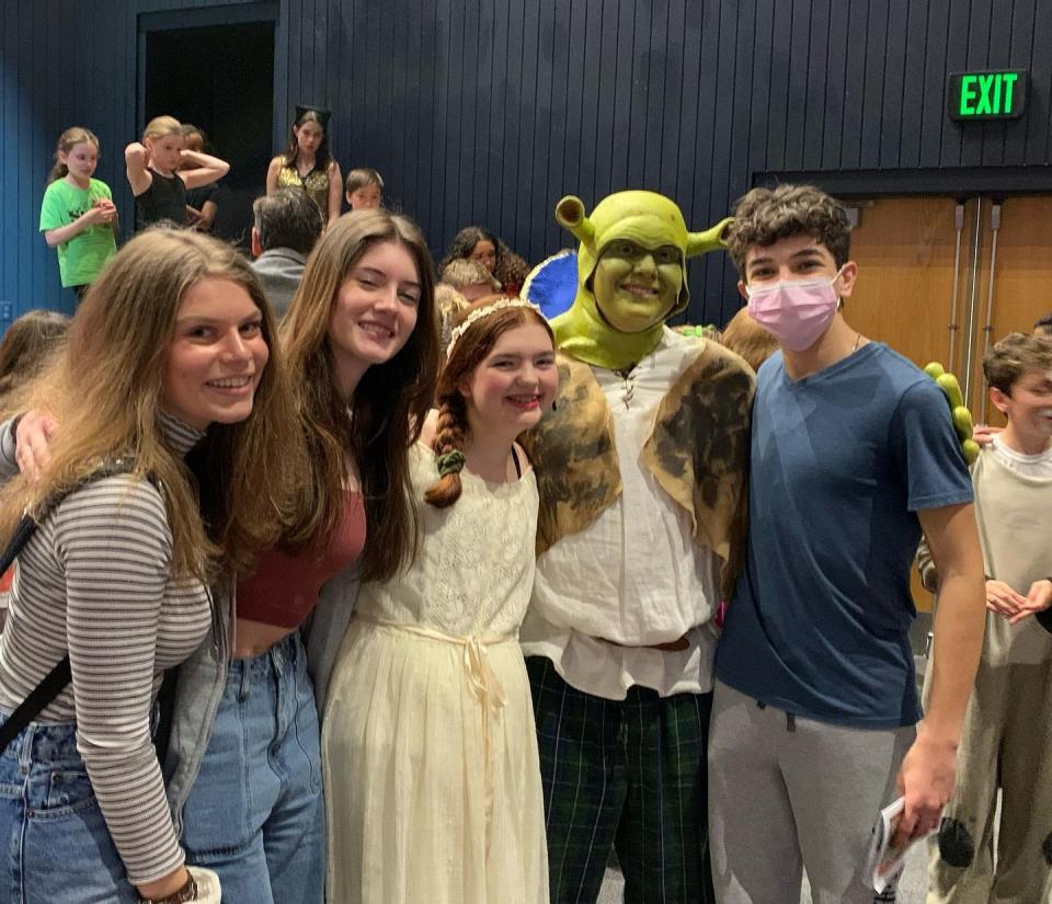 Samantha Boragine (center) posing in costume with friends as Fiona, for a production of Shrek: The Musical, put on in 2022 by DramaFun Musical Theater.