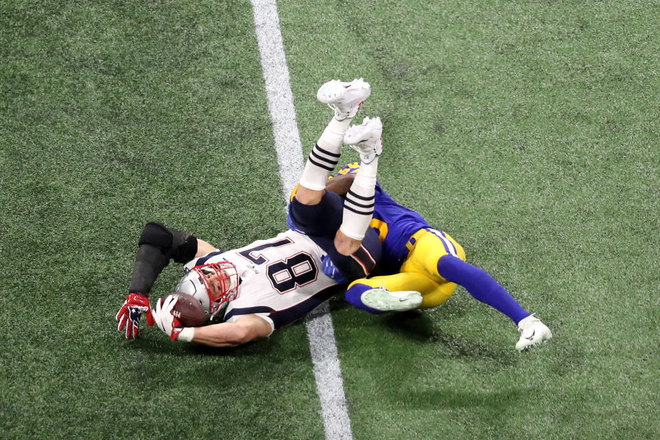 <p>Cory Littleton #58 of the Los Angeles Rams tackles Rob Gronkowski #87 of the New England Patriots in the second quarter during Super Bowl LIII at Mercedes-Benz Stadium on February 03, 2019 in Atlanta, Georgia. (Photo by Rob Carr/Getty Images) </p>
