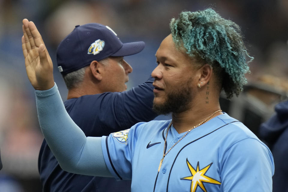 Tampa Bay Rays' Harold Ramirez, right, celebrates with manager Kevin Cash after the team defeated the Chicago White Sox during a baseball game Sunday, April 23, 2023, in St. Petersburg, Fla. (AP Photo/Chris O'Meara)