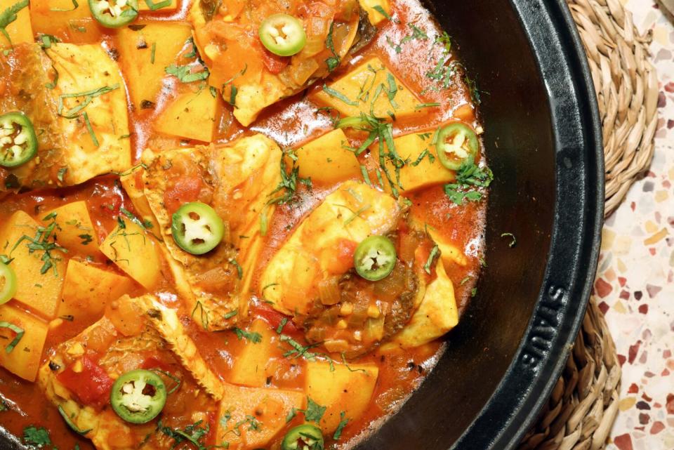 The red snapper tagine dish with tomato, ginger, turmeric, potatoes, serrano, cilantro and served with coconut rice.