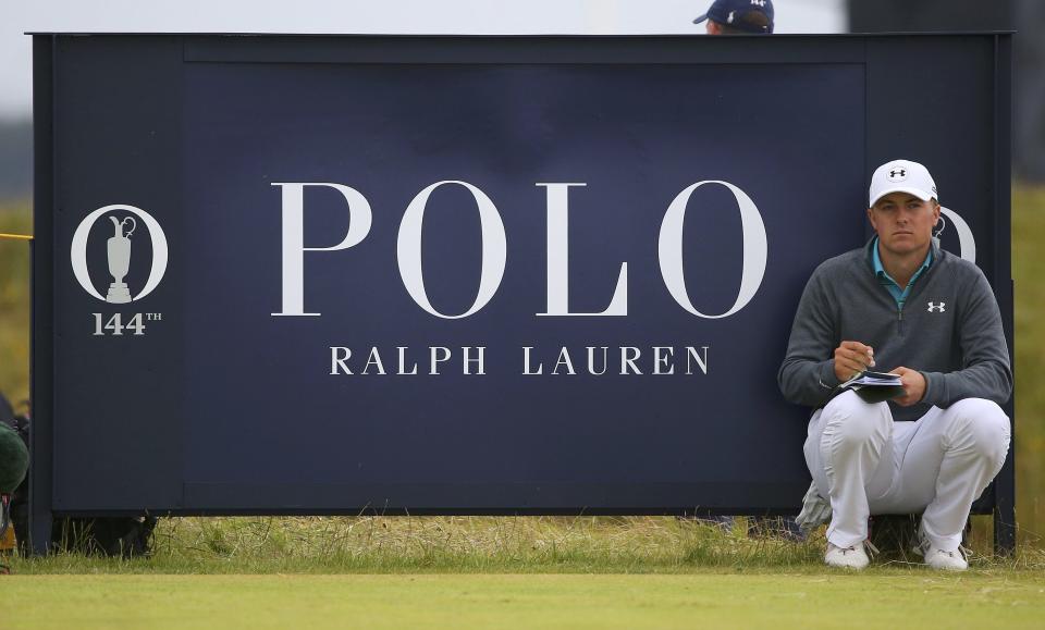 Jordan Spieth of the U.S. marks his card as he sits on the 15th tee during the first round of the British Open golf championship on the Old Course in St. Andrews, Scotland, July 16, 2015. REUTERS/Eddie Keogh