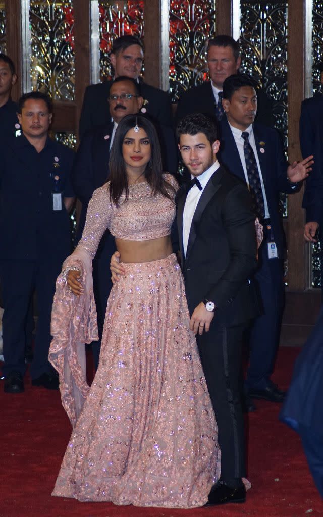 <p>Priyanka Chopra and husband Nick Jonas arrive to attend the wedding of Mukesh Ambani's daughter Isha Ambani and Anand Piramal at their residence Antilia on December 12, 2018 in Mumbai. India. </p>
