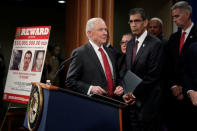 U.S. Attorney General Jeff Sessions (C) and Acting Administrator Uttam Dhillon of the Drug Enforcement Administration (DEA) (2nd R) arrive at a news conference with other law enforcement officials to announce enforcement efforts against Cartel Jalisco Nueva Generacion (CJNG) at the Justice Department in Washington, U.S., October 16, 2018. REUTERS/Yuri Gripas