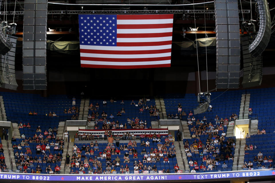 President Donald Trump supporters listen as Trump speaks during a campaign rally in Tulsa/. Source: AP