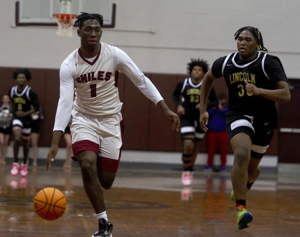 Lincoln boy's basketball defeated Chiles 61-47 on Tuesday, Jan. 16, 2023 in Trojans head coach Andy Colville's 500th win