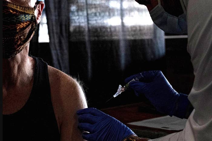 A nurse gives a flu shot to a patient in Detroit on Nov. 10, 2020.