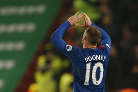Britain Soccer Football - Stoke City v Manchester United - Premier League - bet365 Stadium - 21/1/17 Manchester United's Wayne Rooney celebrates scoring their first goal to break the all time goalscoring record for Manchester United Action Images via Reuters / Andrew Boyers Livepic