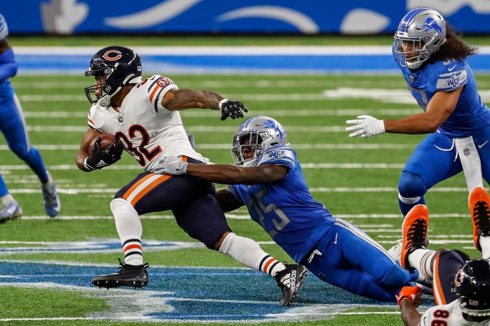 Lions safety Will Harris tries to stop Bears running back David Montgomery during the first half at Ford Field on Sunday, Sept. 13, 2020.