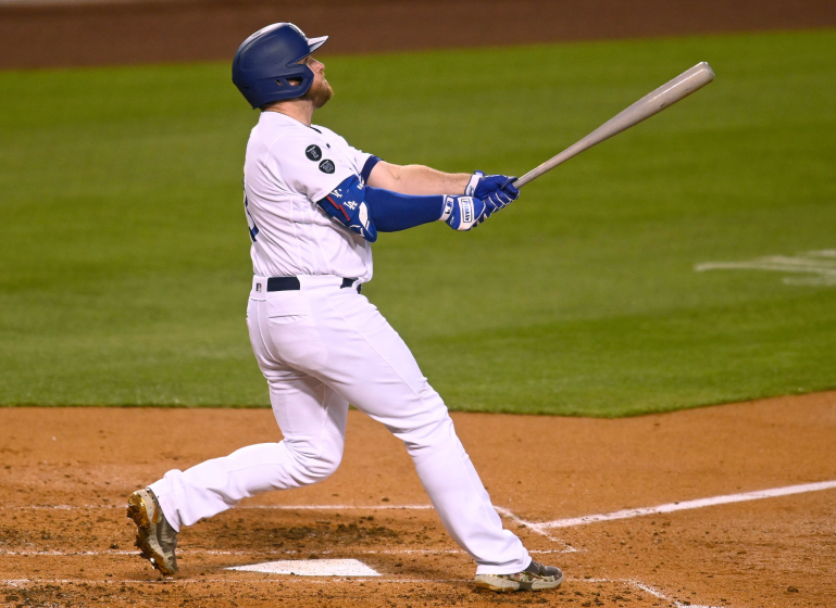 LOS ANGELES, CALIFORNIA - MAY 14: Max Muncy #13 of the Los Angeles Dodgers hits a three run home run.
