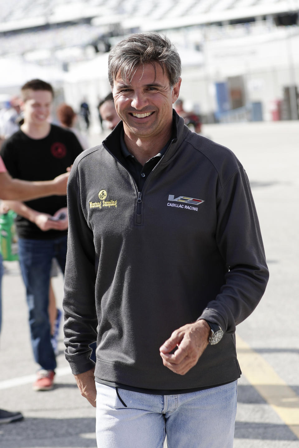 Three-time Rolex 24 Champion and retired driver Christian Fittipaldi walks through the garage area during testing for the upcoming Rolex 24 hour auto race at Daytona International Speedway, Friday, Jan. 3, 2020, in Daytona Beach, Fla. Fittipaldi will serve as the grand marshal for this years Rolex 24 auto race. (AP Photo/John Raoux)