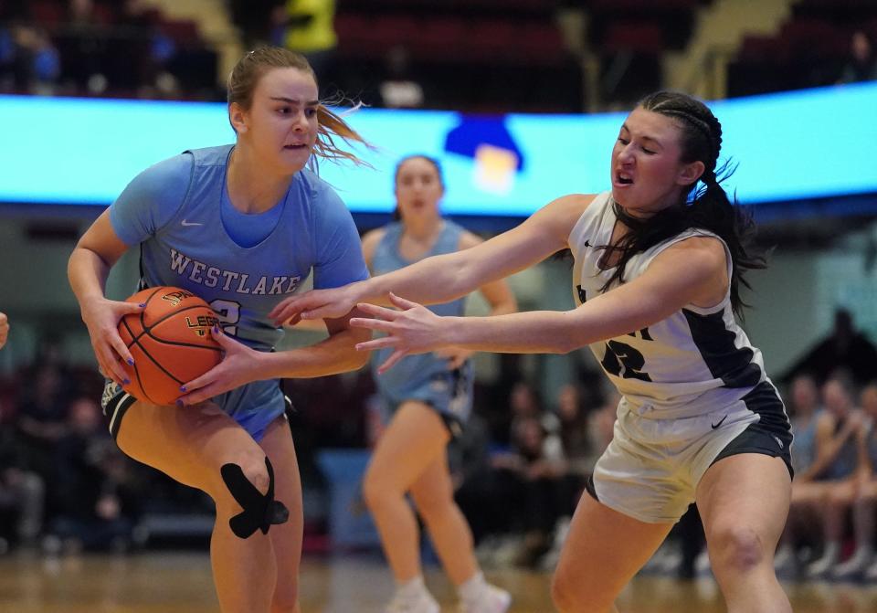 Westlake's Brooke Pfeiffer (2) drives on Putnam Valley's Ava Harman (12) in the Section 1 Class B girls basketball championship game at the Westchester County Center in White Plains on Friday, March 1, 2024.