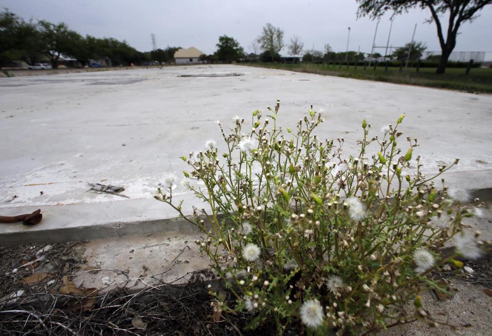 The slab remains of an apartment complex, Thursday, April 17, 2014, in West, Texas, that was destroyed when a nearby fertilizer plant exploded. Today marks the one year anniversary of the explosion at a fertilizer plant that killed fifteen people, including 12 volunteer firefighters and others responding to the fire, and more than 200 were injured. (AP Photo/Tony Gutierrez)