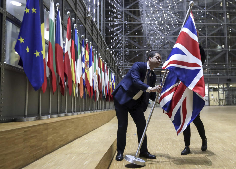 The Union flag is removed from the atrium of the Europa building in Brussels. (AP)