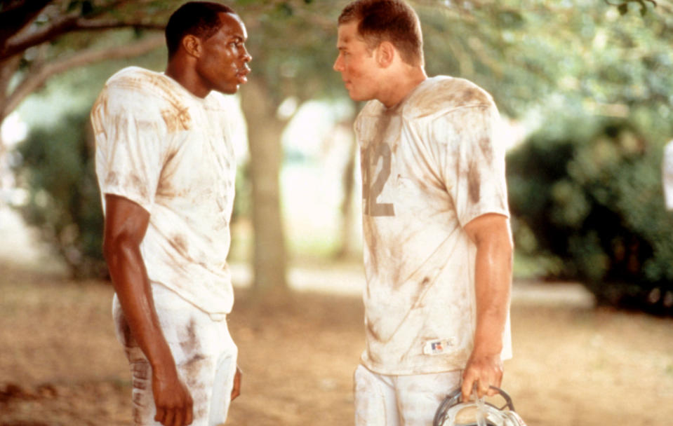 Wood Harris and Ryan Hurst in football uniforms