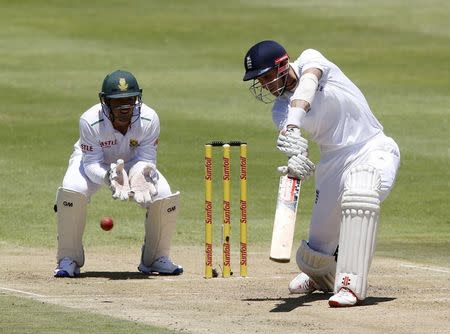 England's Alex Hales plays a shot with South Africa's Quinton de Kock during the second cricket test match in Cape Town, South Africa, January 2, 2016. REUTERS/Mike Hutchings