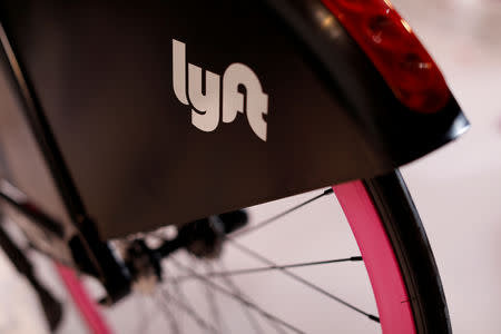 FILE PHOTO: A Lyft bicycle is shown at the Lyft listing on the Nasdaq during an IPO event in Los Angeles, California, U.S., March 29, 2019. REUTERS/Mike Blake