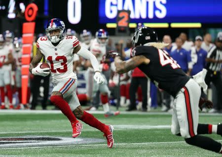 Oct 22, 2018; Atlanta, GA, USA; New York Giants wide receiver Odell Beckham (13) runs after a catch in the first quarter against the Atlanta Falcons at Mercedes-Benz Stadium. Mandatory Credit: Jason Getz-USA TODAY Sports