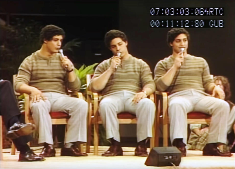 David Kellman, Robert Shafran, Eddy Galland sitting on a stage