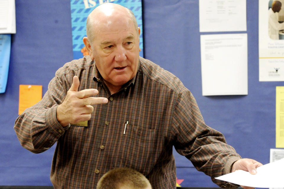 FILE- In this Nov. 5, 2010 file photo, volunteer teacher Dr. Skip McDannald makes a point to his class of students while reviewing a quiz at Hawkinsville High School in Hawkinsville, Ga. Taylor Regional in the small town of Hawkinsville, Georgia, had gone through years of financial troubles before it approached retired Dr. Skip McDannald for help in 2015. (Woody Marshall/The Macon Telegraph via AP, File)