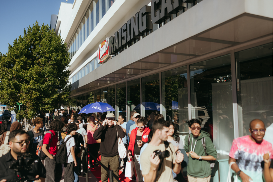 Raising Cane’s opened its second location in South Florida in Miami Beach. Above: A photo of customers waiting to go inside the fast-food chain’s South Beach site.