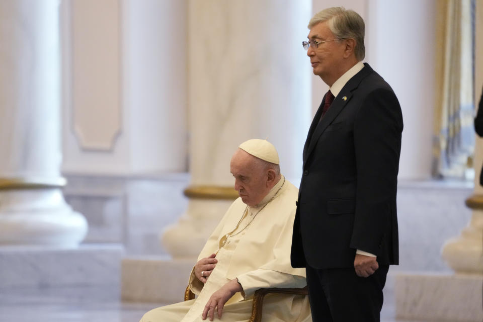 Pope Francis attends with Kazakhstan's President Kassym-Jomart Tokayev the welcome ceremony at the Presidential Palace Ak Orda, in Nur-Sultan, Kazakhstan, Tuesday, Sept. 13, 2022. Pope Francis begins a 3-days visit to the majority-Muslim former Soviet republic to minister to its tiny Catholic community and participate in a Kazakh-sponsored conference of world religious leaders. (AP Photo/Andrew Medichini)