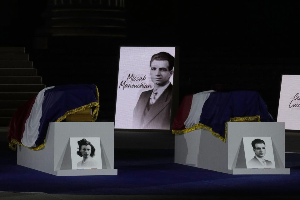The coffins of Missak Manouchian and his wife Mélinée Manouchian lay outside the Pantheon monument, Wednesday, Feb. 21, 2024 in Paris. While France hosts grandiose ceremonies commemorating D-Day, Missak Manouchian and his Resistance fighters' heroic role in World War II are often overlooked. French President Emmanuel Macron is seeking to change that by inducting Manouchian into the Panthéon national monument. (AP Photo/Michel Euler)