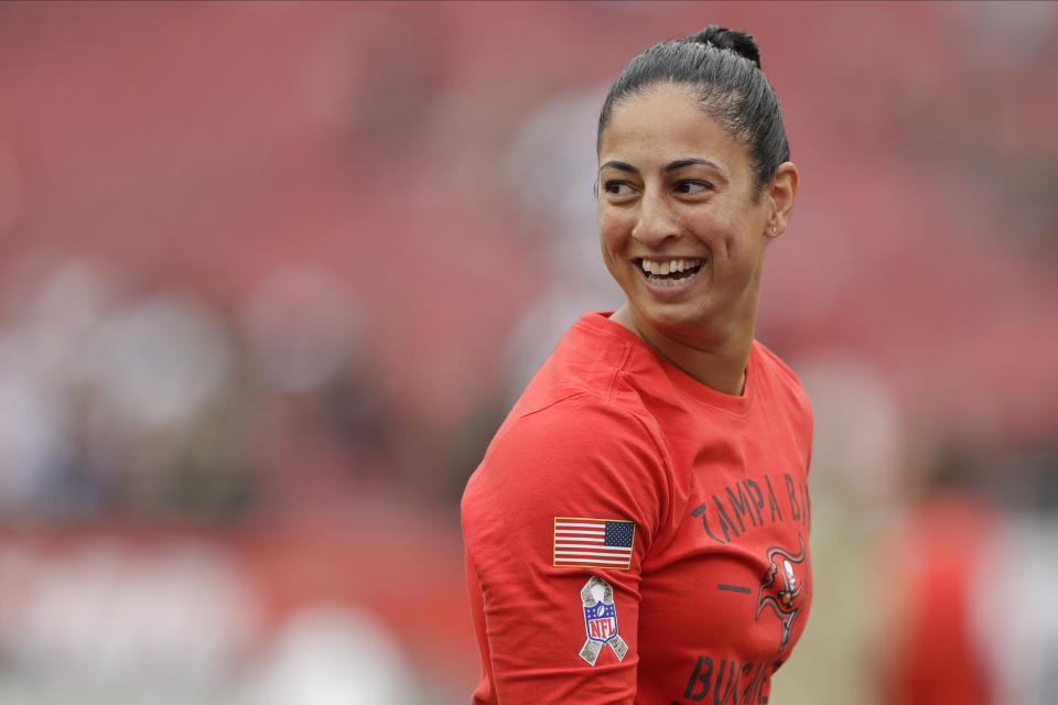 FILE - Tampa Bay Buccaneers coach Maral Javadifar reacts before an NFL football game against the New Orleans Saints, Nov. 17, 2019, in Tampa, Fla. Last year, Buccaneers assistant defensive line coach Lori Locust and assistant strength and conditioning coach Javadifar became the first female coaches on a team to win the Super Bowl. (AP Photo/Chris O'Meara, File)