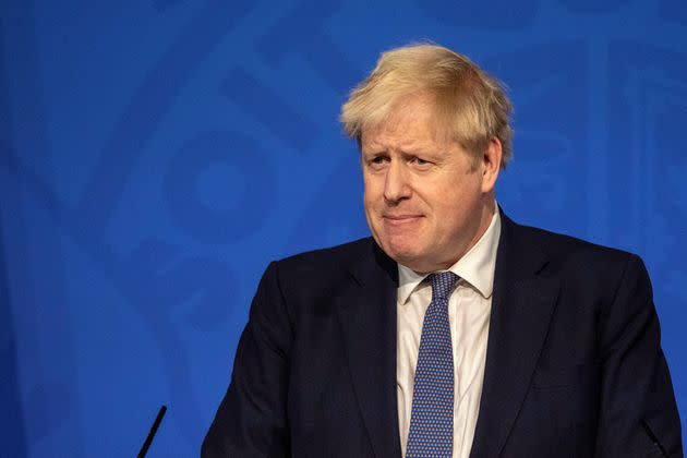 Britain&#39;s Prime Minister Boris Johnson speaks during a virtual press conference to update the nation on the status of the Covid-19 pandemic, in the Downing Street briefing room in central London on January 4, 2022. - British hospitals have switched to a 