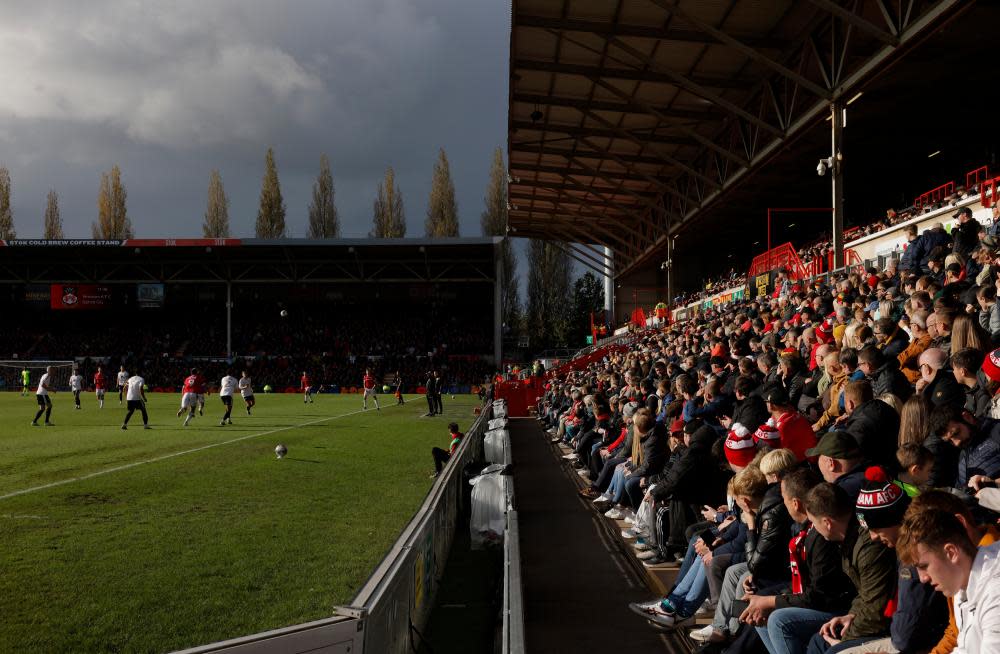 Spectators bathed in autumnal sunshine during the League Two match between Wrexham and Salford City at StoK Cae Ras