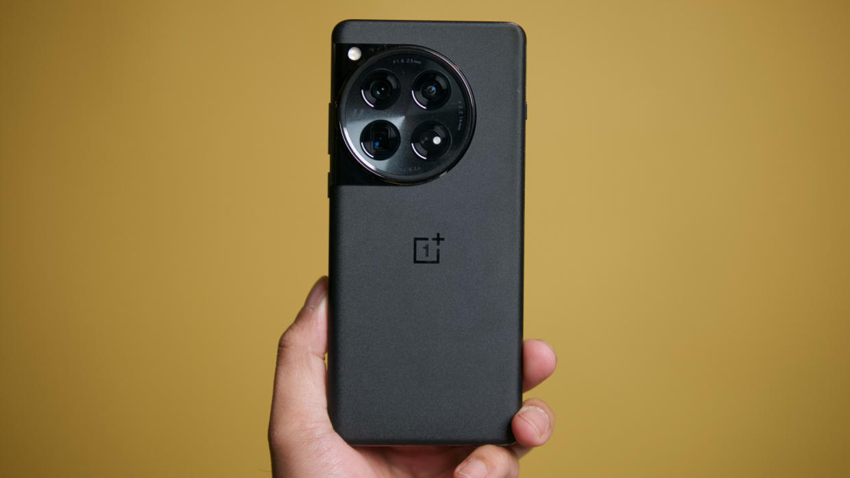  OnePlus 12 held in the hand. 