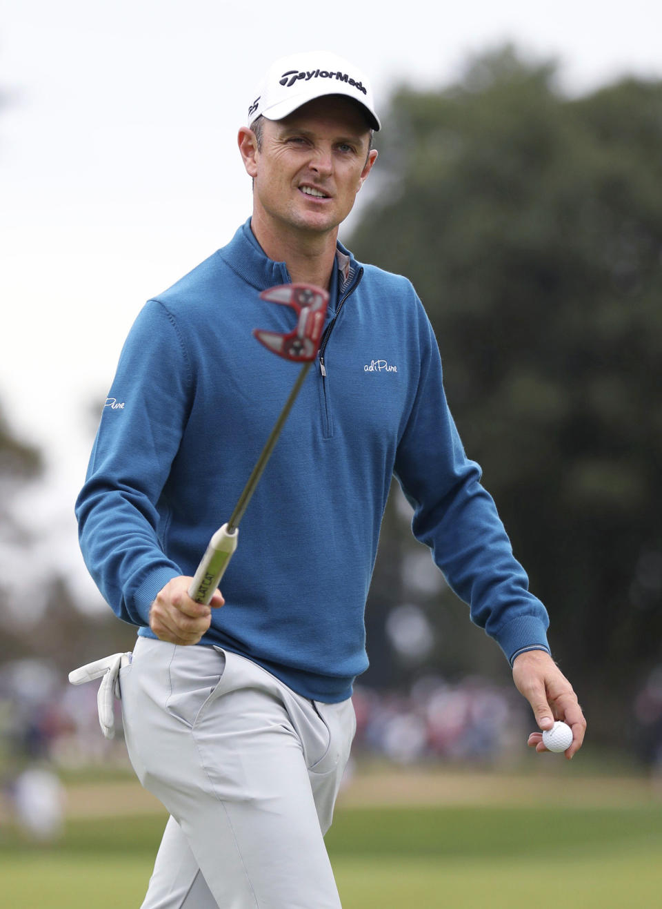 Justin Rose reacts after making a birdie putt on the fourth green during the third round of the BMW Championship golf tournament at Aronimink in Newtown Square, Pa., Saturday, Sept. 8, 2018. (Charles Fox/The Philadelphia Inquirer via AP)