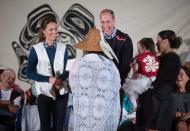 Wearing First Nations vests they were given, Prince William, the Duke of Cambridge, and Kate, the Duchess of Cambridge, are presented with a doll for Princess Charlotte during a welcoming ceremony at the Heiltsuk First Nation in the remote community of Bella Bella, B.C., on Monday September 26, 2016. THE CANADIAN PRESS/Darryl Dyck