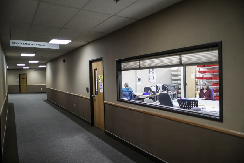 Nevada City, CA, Monday, June 6, 2022 - A recently installed window allows observers to watch poll workers handle and count ballots at the Nevada City Eric Rood Administration Center. Assistant County Clerk, Recorder of Nevada County Natalie Adona is running for County Clerk and has been targeted with apparently racist attack ads from her opponent Paul Gilbert, self-titled election auditor who believes the voting systems are susceptible to cheating.(Robert Gauthier/Los Angeles Times)